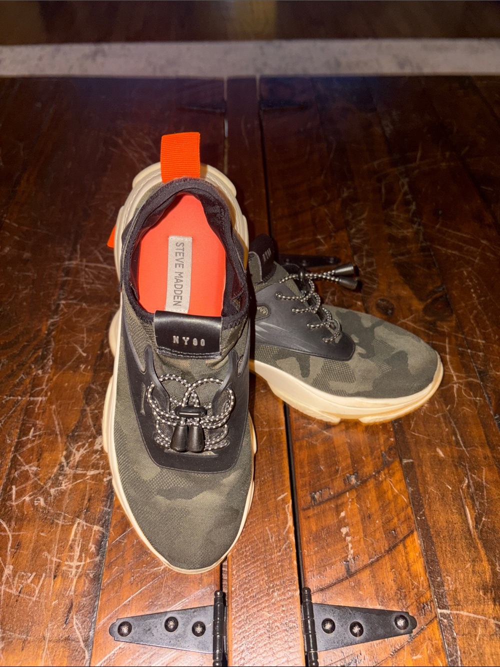Steve Madden women’s  Olive Camouflage Slip-On Sneakers with Orange Pull Tab